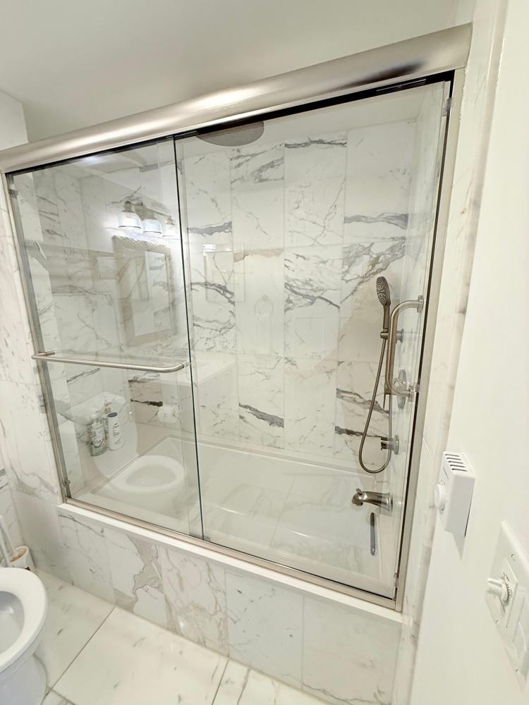 Tub and shower glass after a move-out cleaning